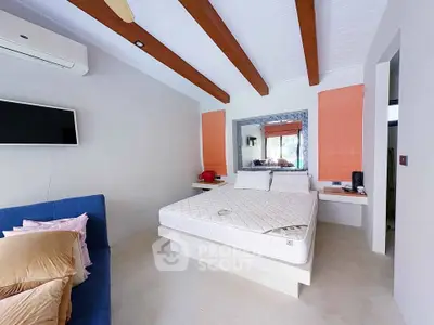 Modern bedroom with exposed beams and minimalist decor, featuring a wall-mounted TV and air conditioning.