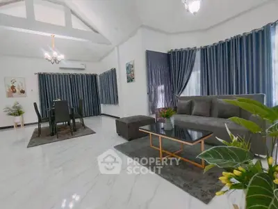 Spacious modern living room with elegant decor and ample natural light