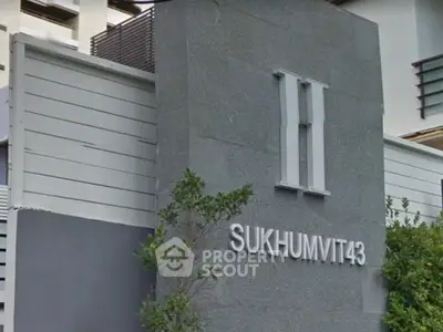 Modern building entrance with sleek design at Sukhumvit 43, ideal for urban living.