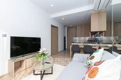 Modern living room with stylish decor and open kitchen layout