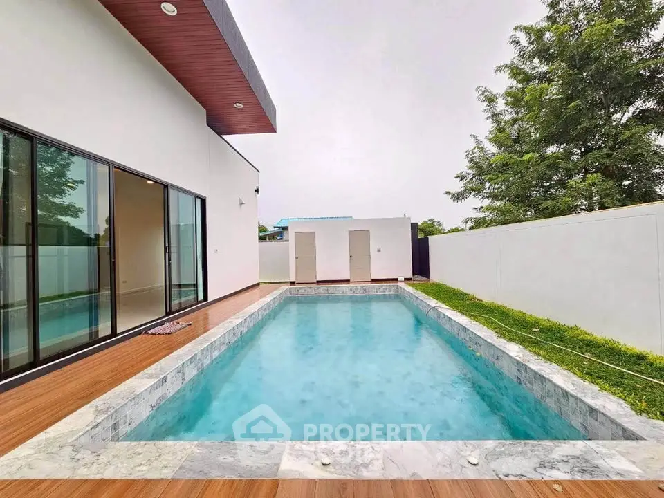 Luxurious modern home with private pool and spacious outdoor area, perfect for relaxation and entertainment.
