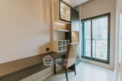 Modern study area with sleek desk and city view balcony