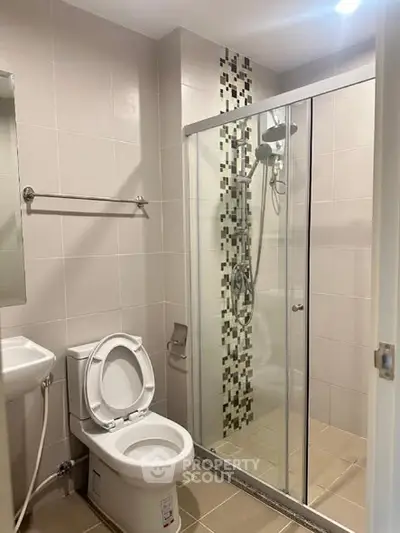 Modern bathroom with glass shower and sleek tile design