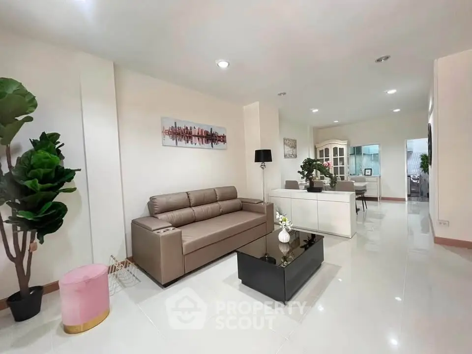 Spacious modern living room with elegant decor and open layout, perfect for comfortable living.