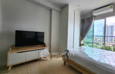 Modern bedroom with balcony view in high-rise apartment