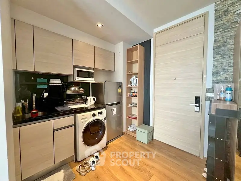 Modern kitchen with integrated washing machine and sleek cabinetry