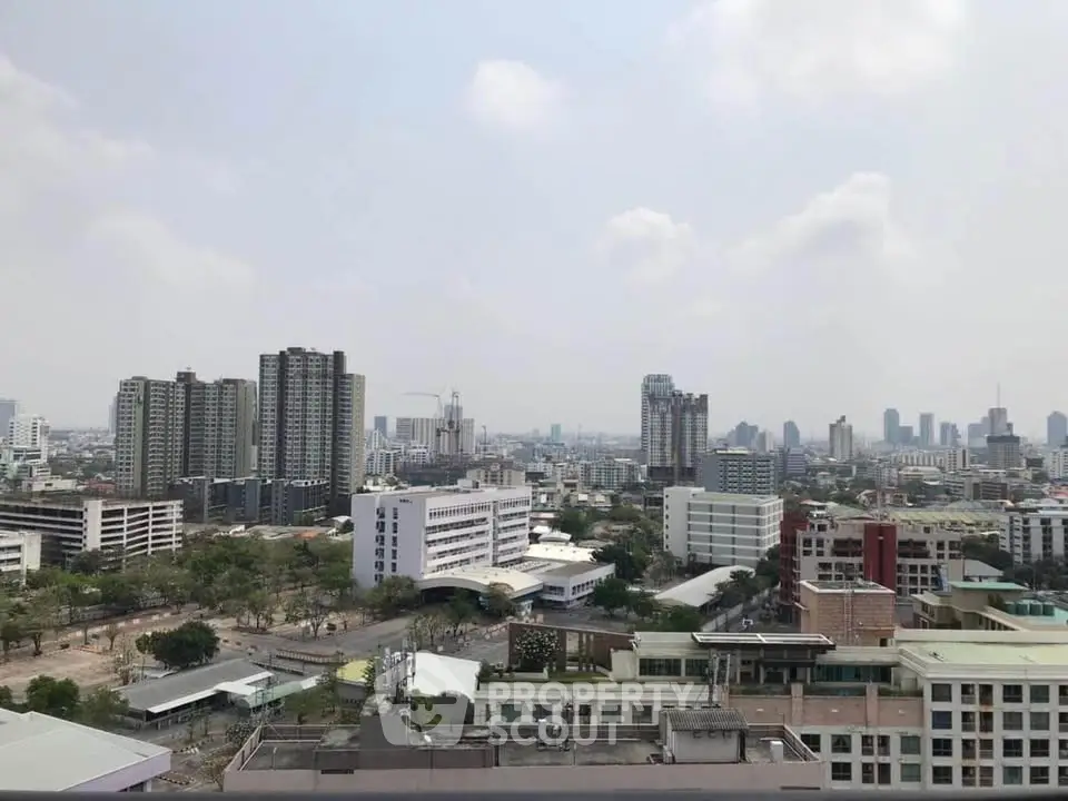 Stunning cityscape view from a high-rise building showcasing urban skyline and architecture.