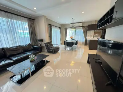 Spacious modern living room with open kitchen and elegant furnishings