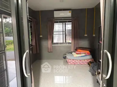 Spacious unfurnished room with air conditioning and large windows in a modern home.