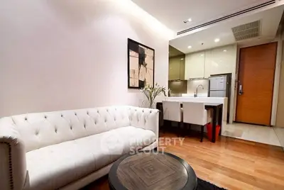 Modern living room with elegant white sofa and stylish kitchen area