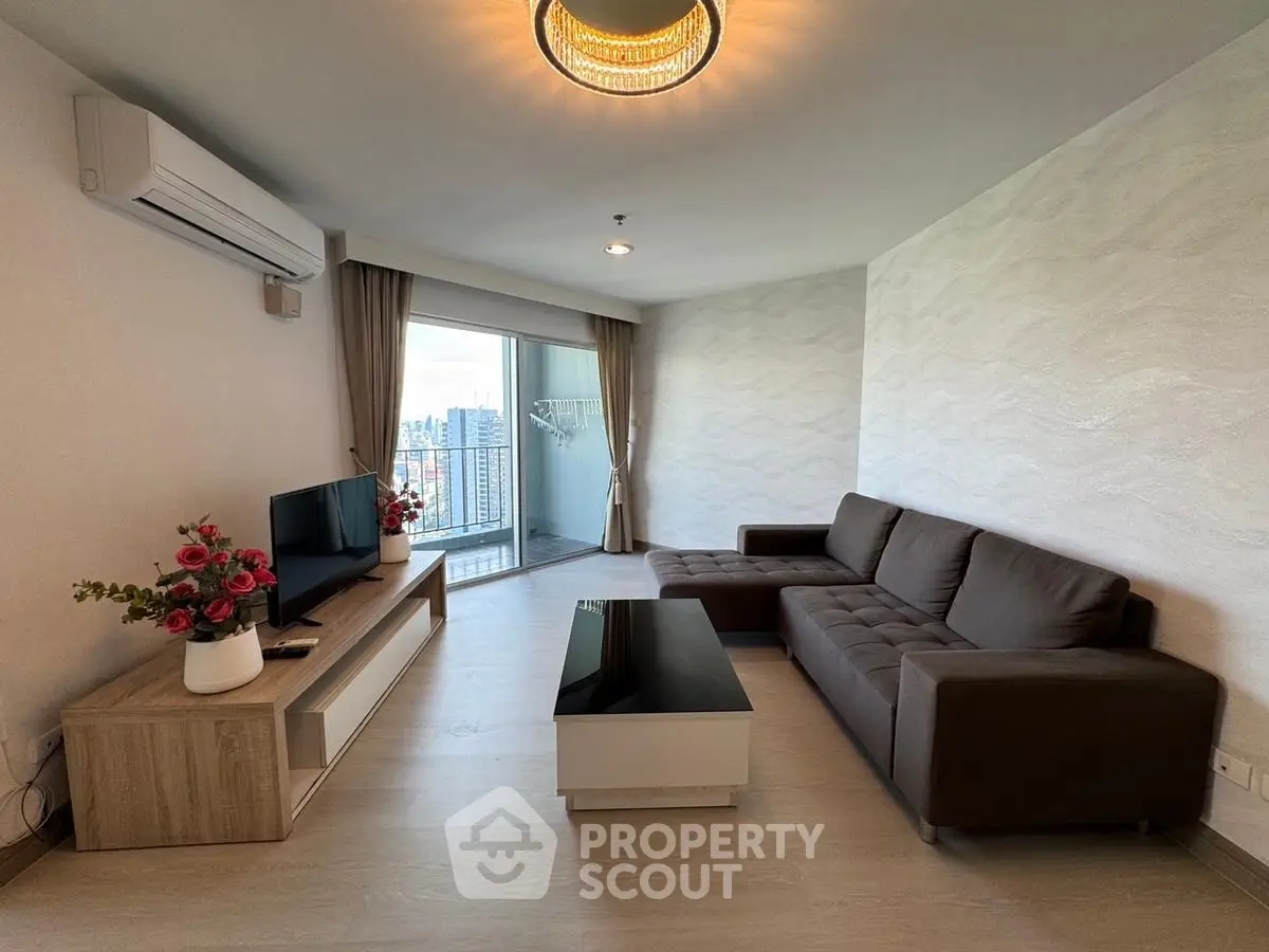 Modern living room with city view, stylish furniture, and elegant decor