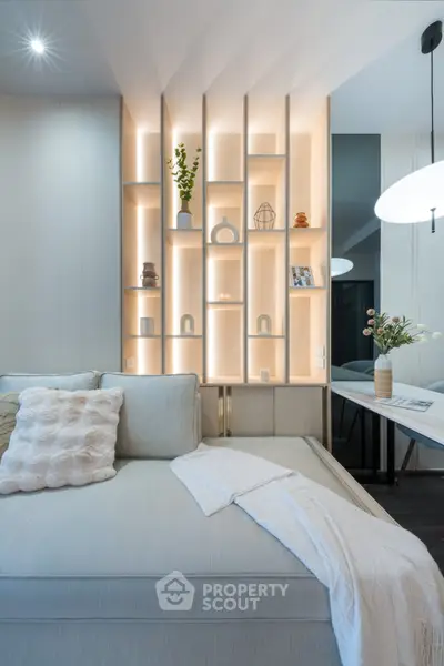 Modern living room with stylish shelving and cozy seating area