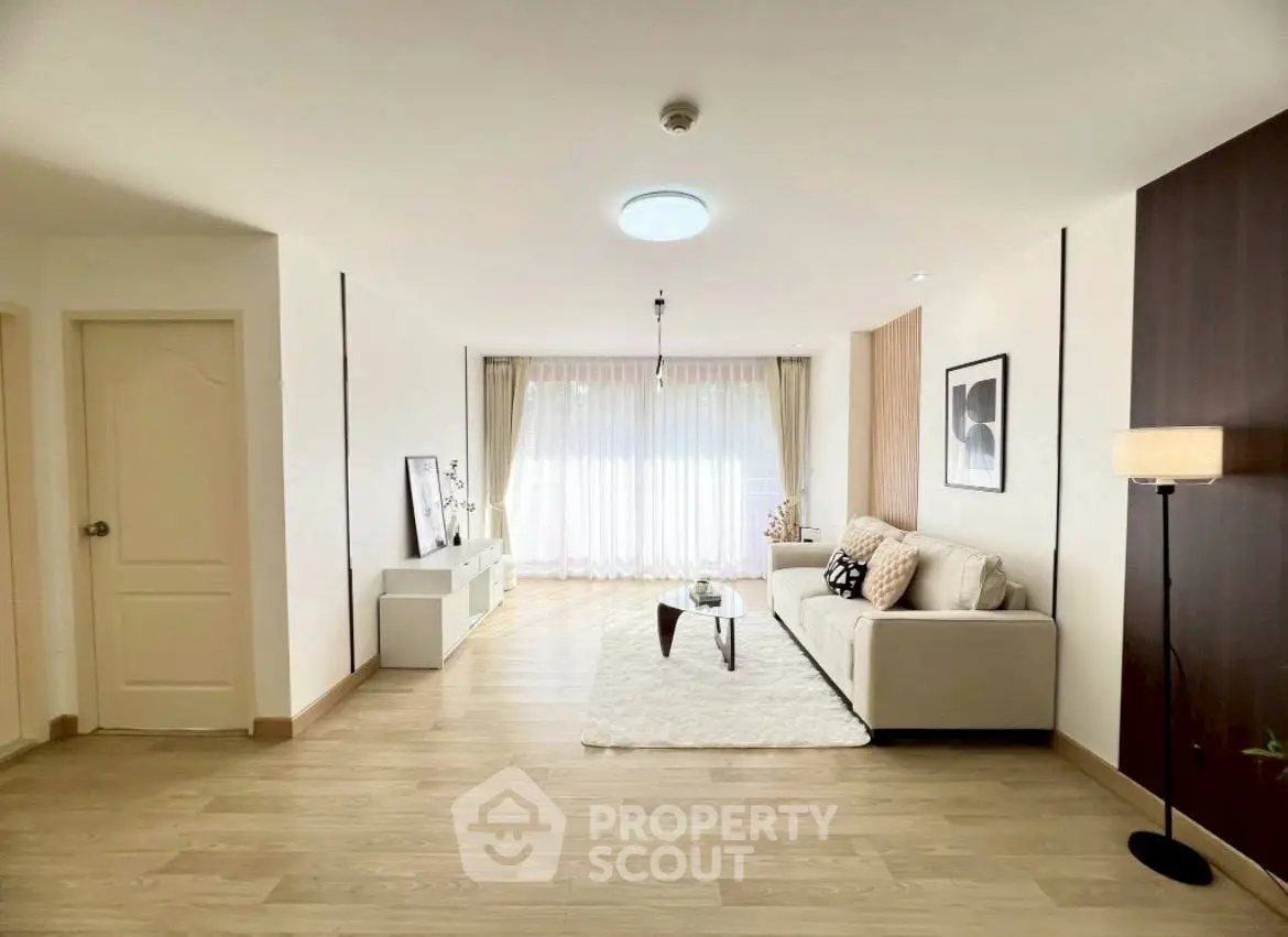 Spacious modern living room with elegant decor and natural light