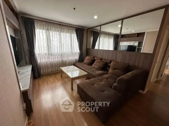 Cozy living room with modern decor and large windows