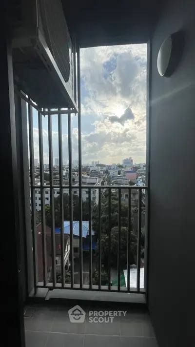 Stunning city view from a modern balcony with air conditioning unit.