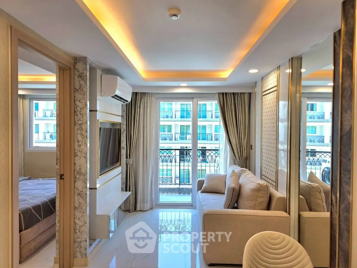 Luxurious modern living room with elegant decor and large windows offering a stunning view.