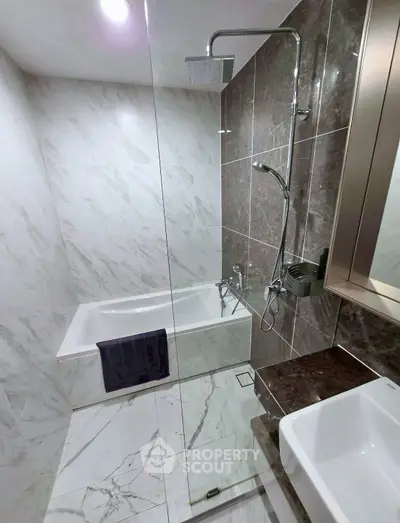 Luxurious modern bathroom with marble tiles and sleek fixtures