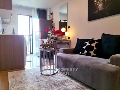 Stylish modern living room with cozy sofa and chic decor in a bright apartment.