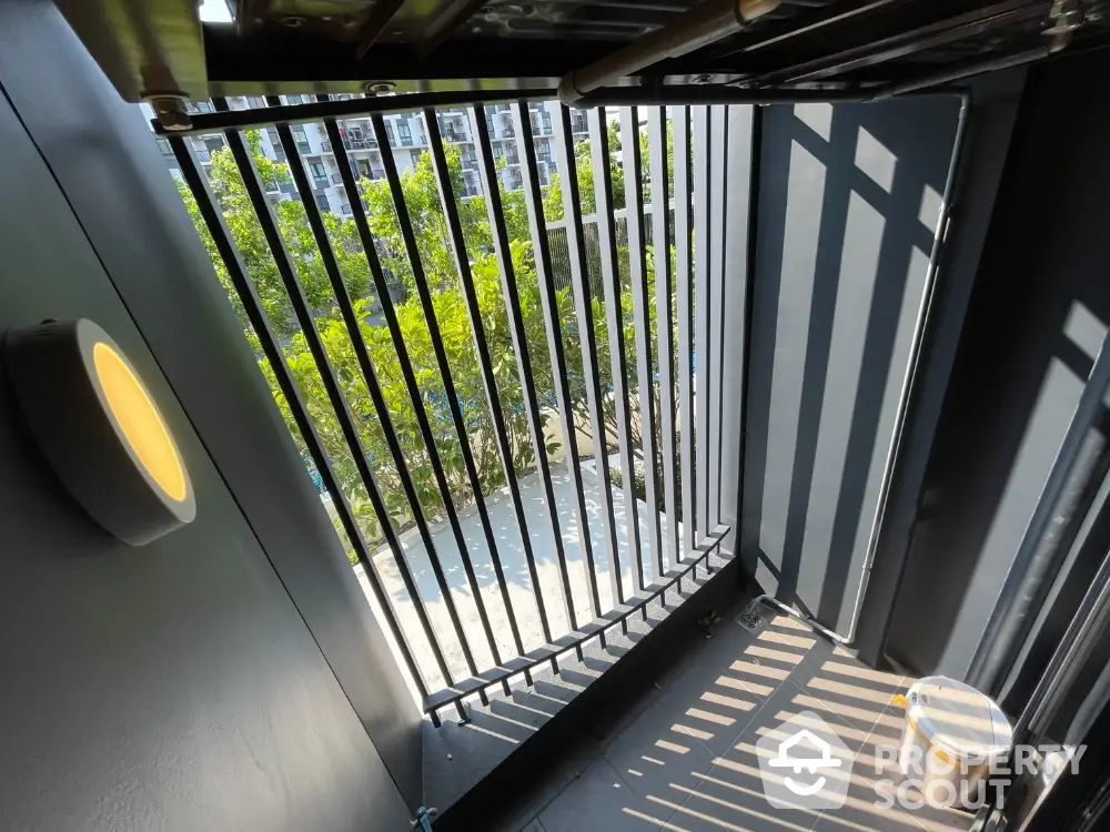 Modern balcony with sleek metal railings and urban view