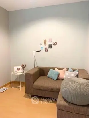 Cozy living room with modern sofa and stylish decor in a bright apartment.