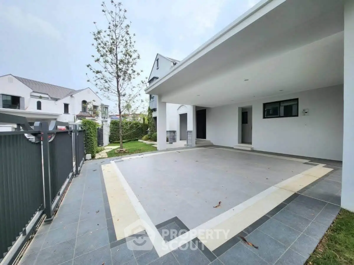 Spacious modern driveway with sleek design in a suburban home, perfect for multiple vehicles.