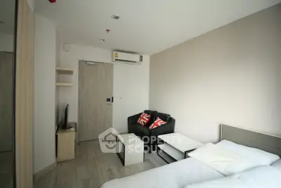 Modern studio apartment with cozy living area and minimalist design