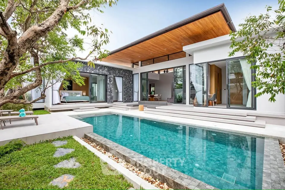 Luxurious modern villa with private pool and lush garden, perfect for relaxation and entertaining.