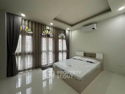 Spacious bedroom with modern design and natural light