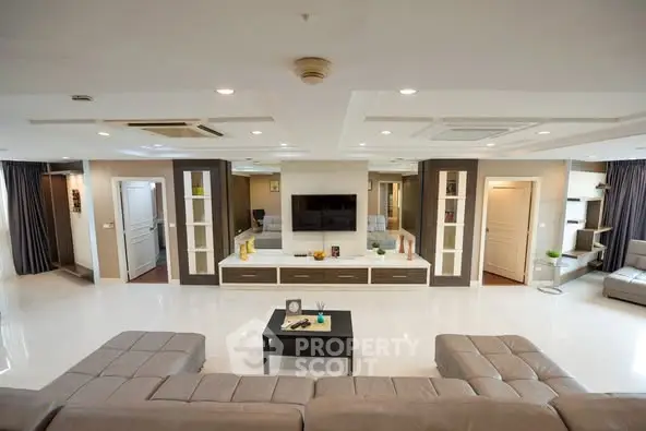 Spacious modern living room with sleek design and ample seating