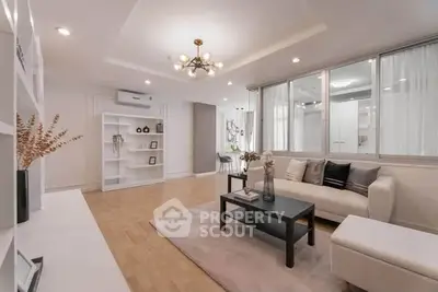 Spacious modern living room with elegant decor and ample natural light