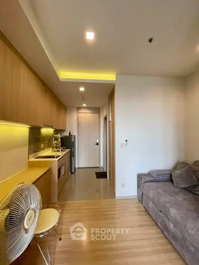 Modern apartment interior with cozy living area and sleek kitchen design