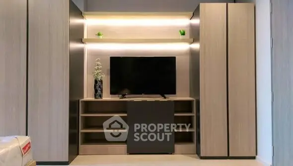 Modern living room with sleek TV unit and ambient lighting