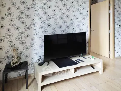 Stylish living room with floral wallpaper and modern TV setup