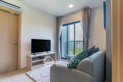 Modern living room with balcony view, sleek furniture, and natural light.