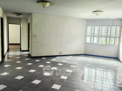 Spacious empty living room with tiled floor and large window view
