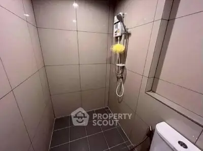 Modern bathroom with sleek tile design and shower area