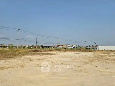 Expansive vacant land with development potential in a serene suburban setting.