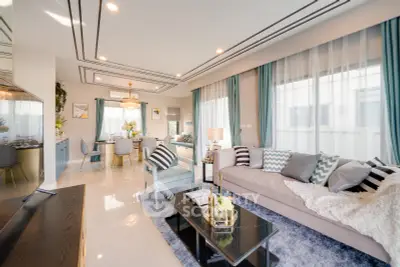 Luxurious modern living room with elegant decor and abundant natural light