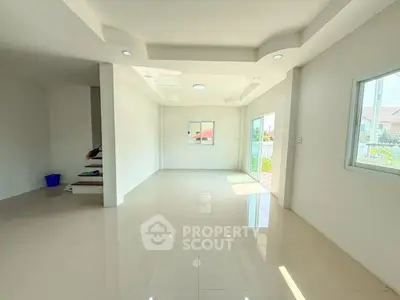 Spacious and bright living room with modern design and large windows