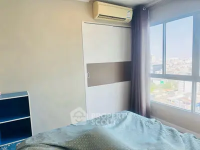 Bright bedroom with city view and air conditioning