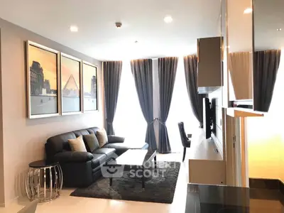 Modern living room with elegant decor and large windows in a stylish apartment.