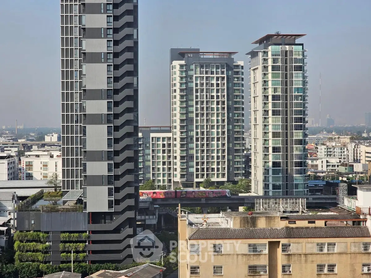 Stunning urban skyline view featuring modern high-rise residential buildings with lush greenery.