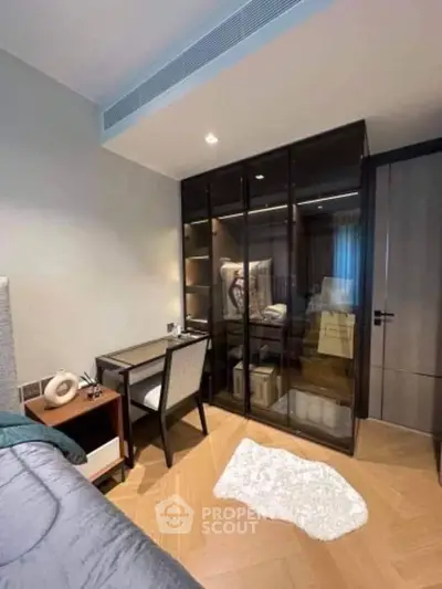 Stylish bedroom with glass wardrobe and cozy decor