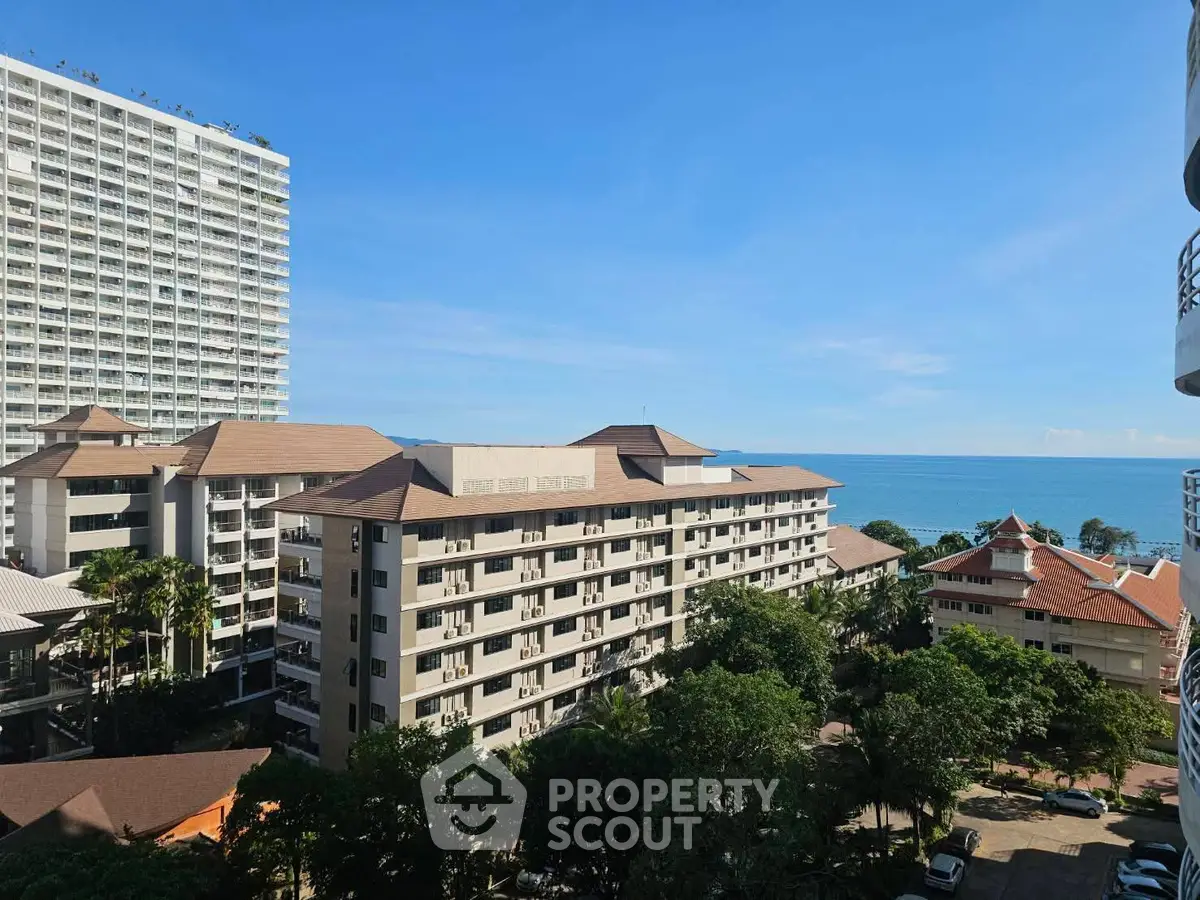Stunning coastal view from high-rise building with ocean backdrop.