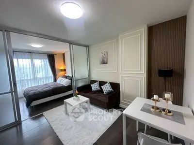 Modern studio apartment with cozy living area and stylish decor