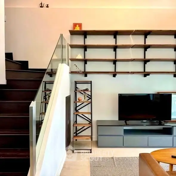 Modern living room with stylish shelving and sleek TV setup