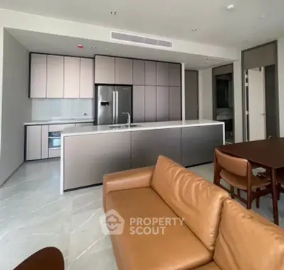 Modern open-layout kitchen with sleek cabinetry and stainless steel appliances