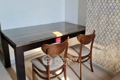 Stylish dining area with elegant wooden table and chairs, perfect for modern interiors.