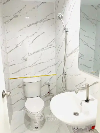 Modern bathroom with sleek marble tiles and contemporary fixtures