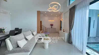 Spacious modern living room with elegant decor and pool view